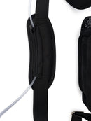 Black backpack strap with padded section, zipper pocket, and clear oxygen tubing