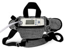 Inogen One G4 portable oxygen concentrator in a black and white houndstooth carry bag with a strap