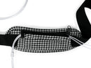 Black and white houndstooth cannula bag with zippered pocket and adjustable strap